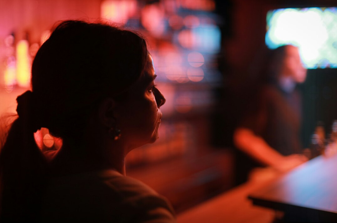 Broadcast producer monitoring multiple screens in a control room